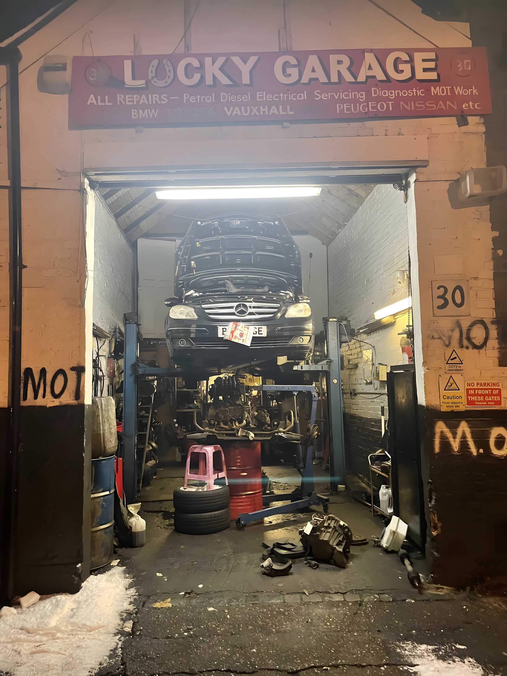 The Lucky Garage shopfront on Morris Road with the workshop door open